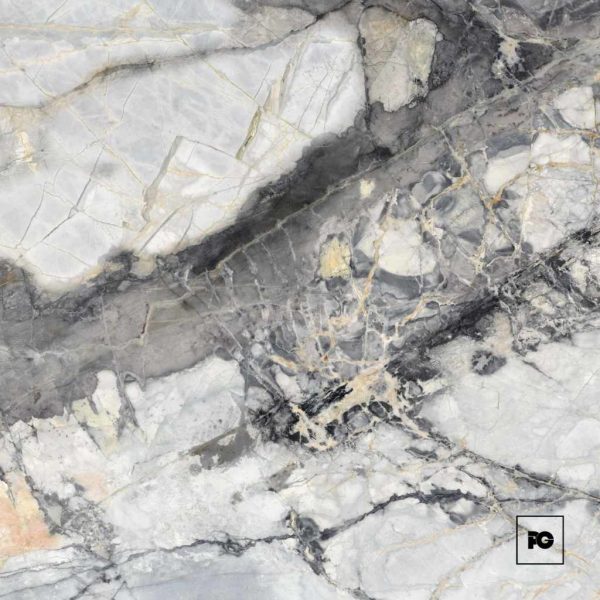 Close-up of gray and white marble with gold veining; fg logo in bottom-right corner