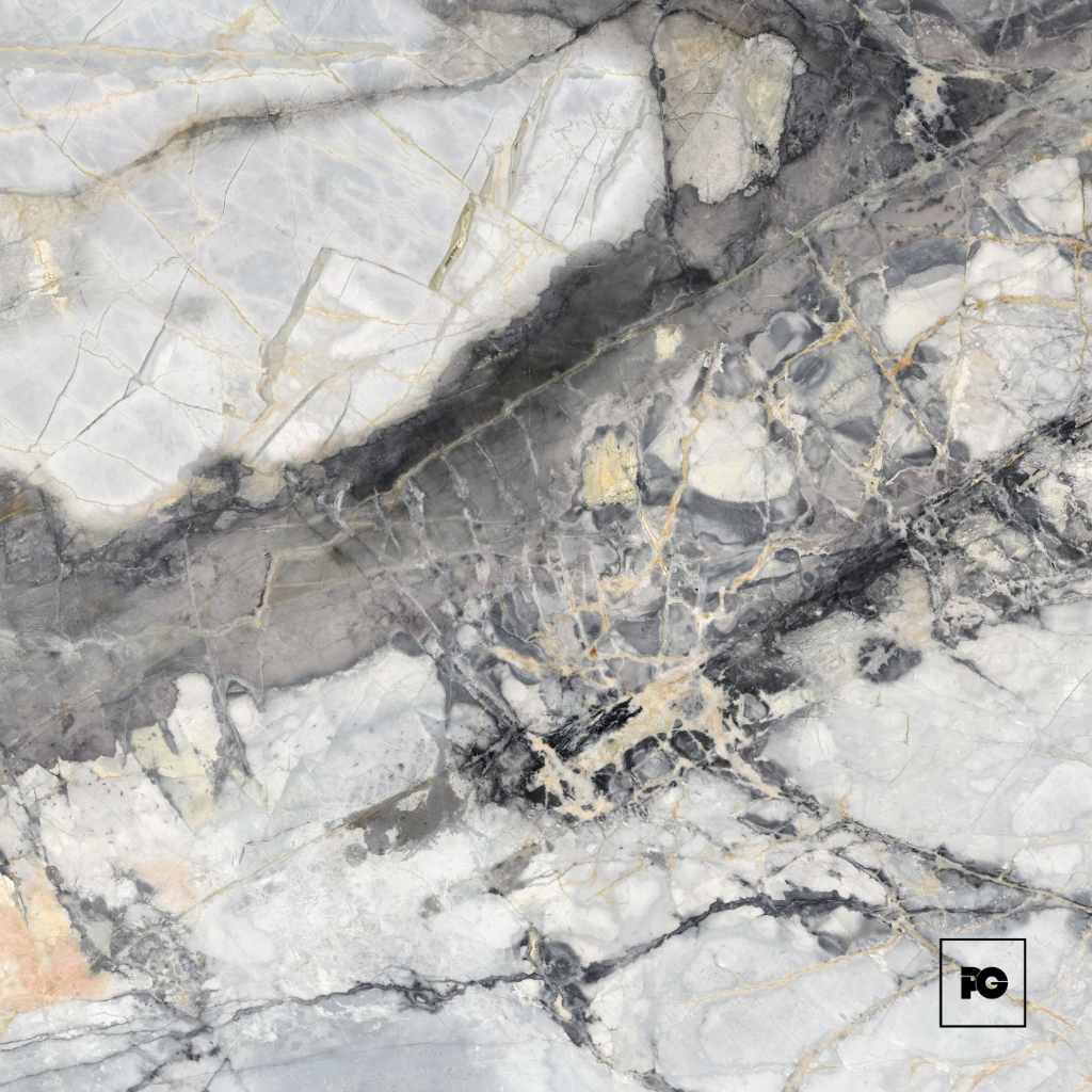 Close-up of gray and white marble with gold veining; FG logo in bottom-right corner